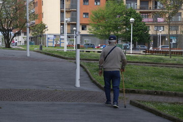 Ageing man walking in the street
