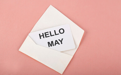 Word Writing Text HELLO MAY on card on the pink background