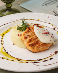 Fish with a side dish. Baked fish. Restaurant menu