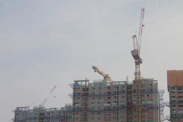 Lots of apartment are being constructed in Korea.
