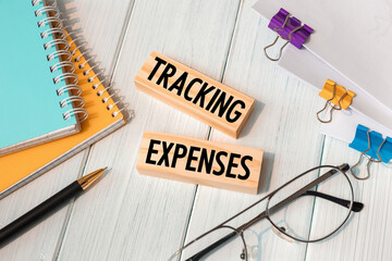 Tracking Expenses - words written on wooden blocks