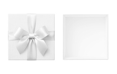 Open white gift box with lid and white bow cut out on white background, wedding present top view