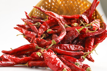 Dried red chilli wooden bowl on white background.