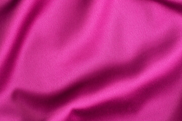Fototapeta na wymiar Pink crimson silk texture, background of clothing material.