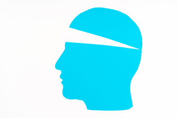 The paper profile of the head is blue with a slightly open top. The concept of thought filling