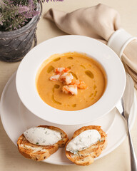 Delicious fresh cream soup. Soup with bruschetta. Restaurant menu