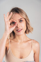 Fototapeta premium Portrait of a girl of European appearance on a light background