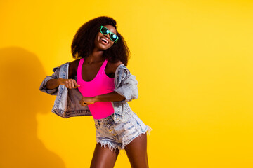 Photo of charming afro american woman dance copyspace summer isolated on shine yellow color background