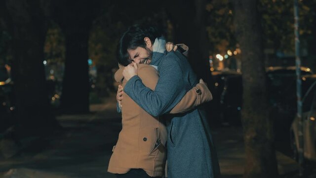 Couple hugs after a strong emotion and they cry holding on tight