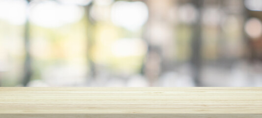 Empty wood table top with cafe restaurant interior blur background