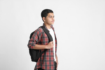 handsome student with backpack standing on white background.