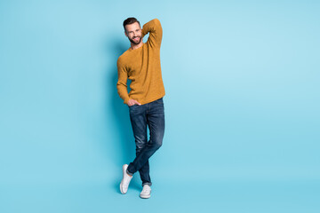 Naklejka premium Full size photo of young handsome smiling cheerful good mood man posing flirting isolated on blue color background