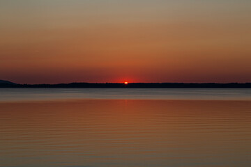 Naklejka premium sunset over lake Chiemsee in the bavarian alps in Germany