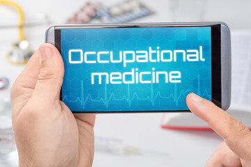 Smartphone with the text Occupational medicine on the display