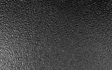 Black metallic foil paper texture background.