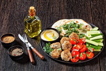 lamb meatballs with veggies and hummus, top view