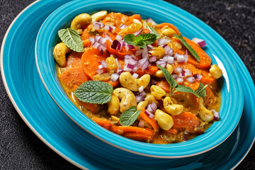 carrot curry with cashew and raisins, top view
