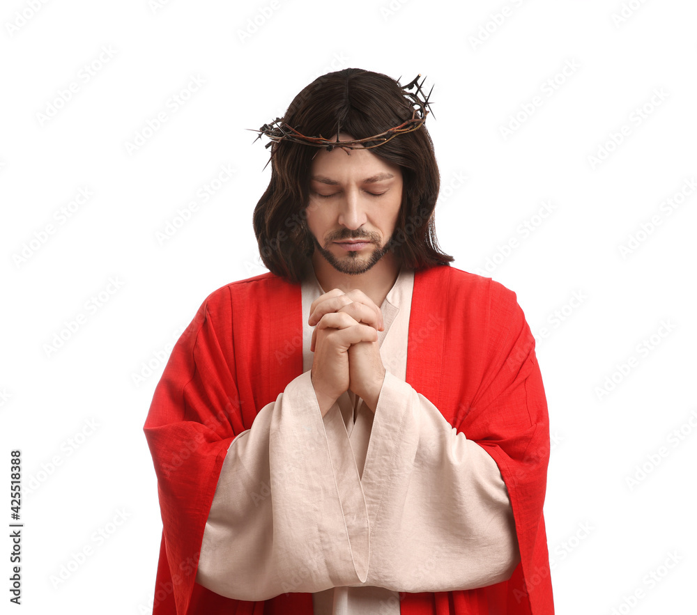 Wall mural Jesus Christ with crown of thorns praying on white background