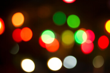 Blurred colorful bokeh lights in the night