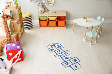 Blue hopscotch floor sticker in playing room