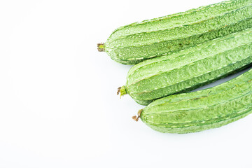 Fresh angular loofah on white background