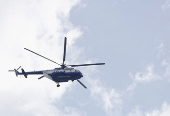 Naklejka na ściany i meble Police helicopter monitoring the situation