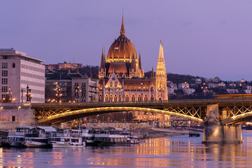 Evening in Budapest, Parliament against the background of the Margaret Bridge, the reflection of lights in the water