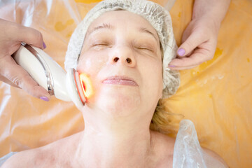 Non-surgical anti-ageing facial skin care . Apparatus cosmetology. VIP treatment. Anti-ageing mask...