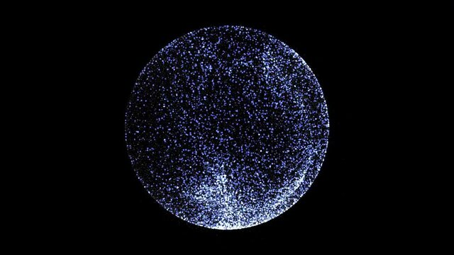 Lighting dots forming a sphere on black background.
