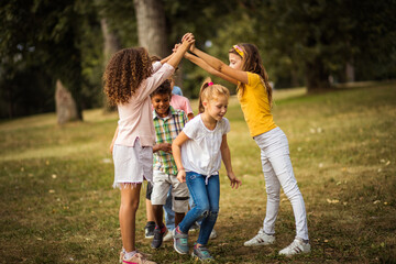 School friends playing in nature.