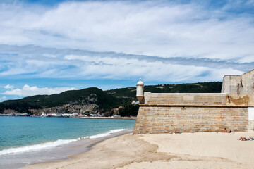 Views of the Sesimbra Beach and fortress in spring in Portugal