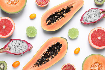 Different exotic fruits on white background, flat lay