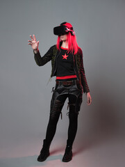 Stylish young gamer in a virtual reality helmet, playing in simulations,