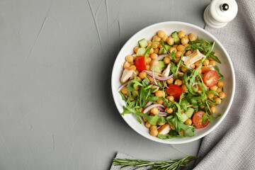 Delicious fresh chickpea salad served on light grey table, flat lay. Space for text
