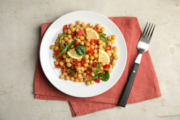 Delicious fresh chickpea salad on light grey table, flat lay