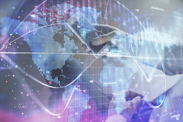 Double exposure of man's hands holding and using a phone and international business theme drawing.