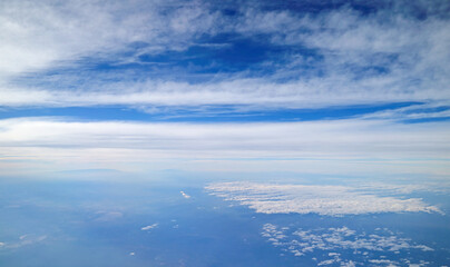 Various Cloud Types on the Sky View from Airplane Window During Flight