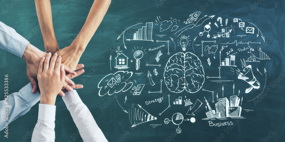 Aufkleber business training concept with business people hands in a pile on green blackboard background with h