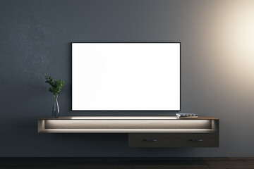 Blank white TV screen over stylish wooden console with dark background. 3D rendering, mockup