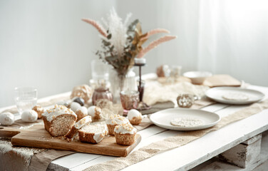 Easter table setting with decor details and homemade cakes.