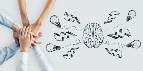 Startup concept with human hands on white surface and handwritten sketch of brain parts, light...