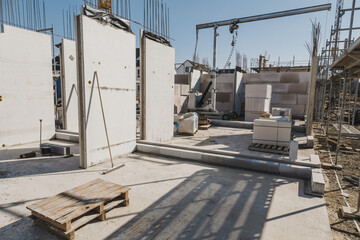 new build house construction with finished foundation and first walls put up