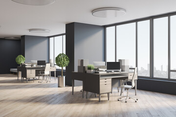 Modern open space office with eco style interior design, wooden table, floor, tree in a flowerpot, dark walls and huge window with city view