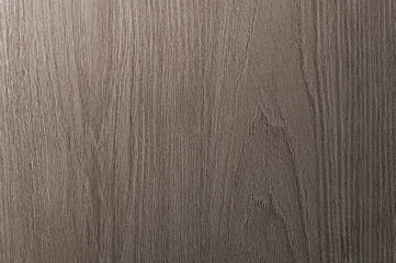 Grey is a brown wooden background with beige veins. Medium dark textured longitudinal cut.