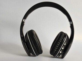 Fototapeta na wymiar Black large wireless headphones, on a white background