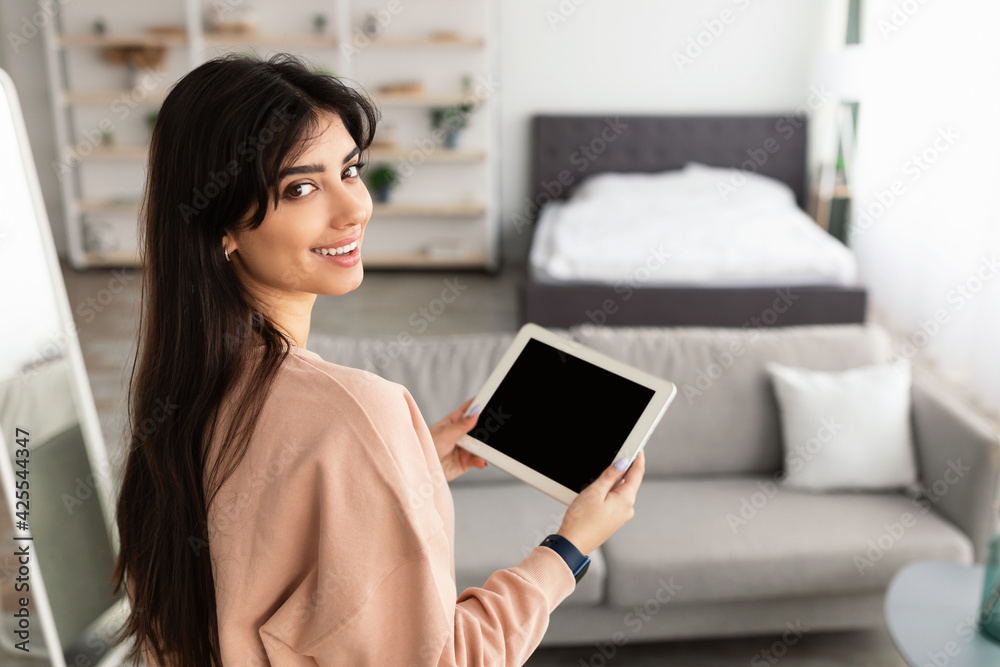 Poster woman using digital tablet with blank empty screen, mockup
