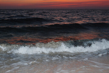 waves on the beach at sunset