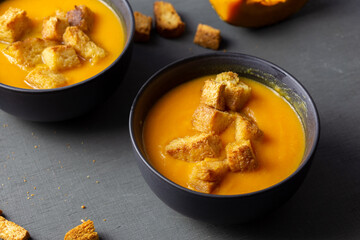 Pumpkin soup served with croutons