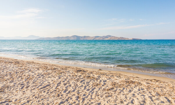 Tigaki beach, Kos, Greece. Beautiful sandy beach with saturated blue water on a sunny day. Dodecanese islands, Aegean Sea