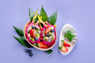 Tropical dragon fruit on colourful background. Minimalism design concept.